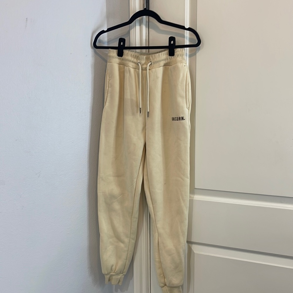 Cream Colored Sweats with a Unicorn logo